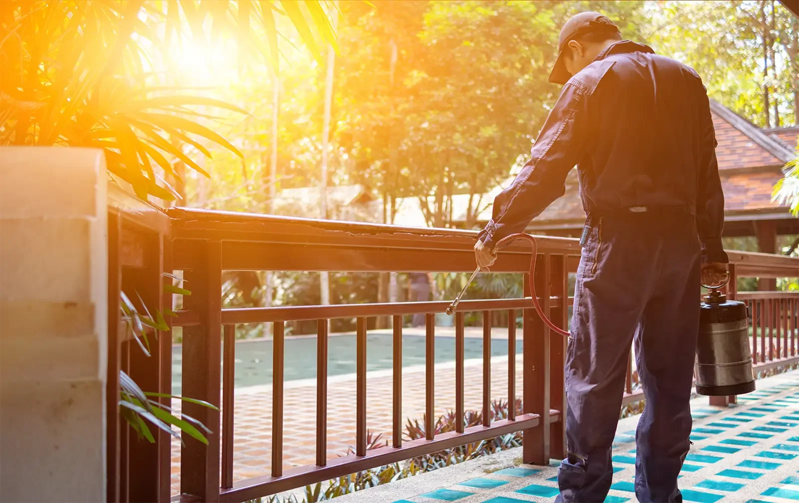 Pest control technician treating a residential property in Brisbane